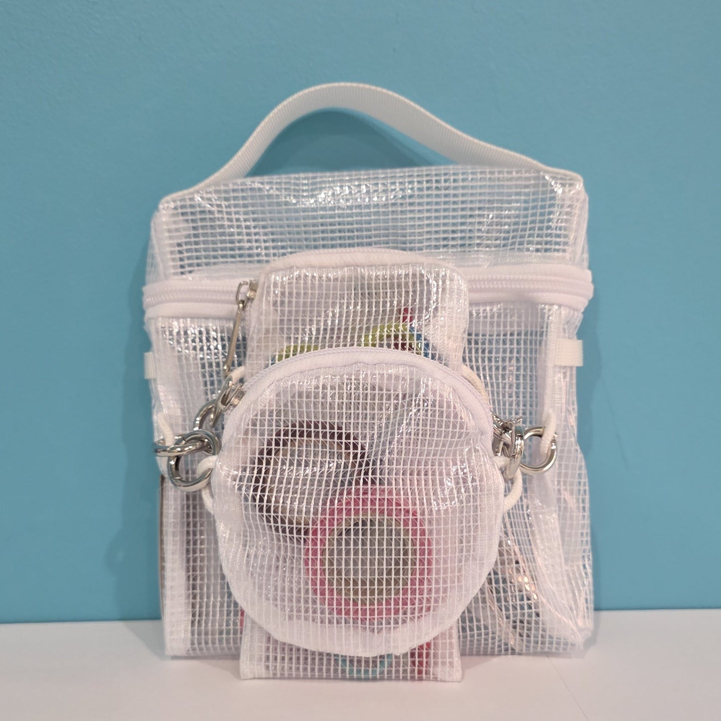 Crossbody pouches, small square, round, and pen pouch connected with round connector clips